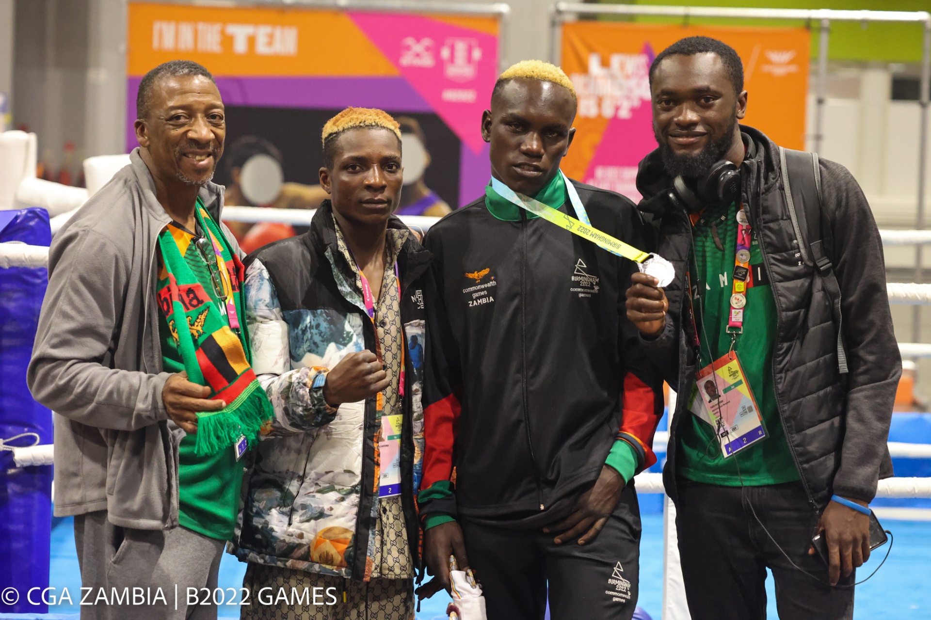 Celebrating with the boxing team after Stephen Zimba's silver medal