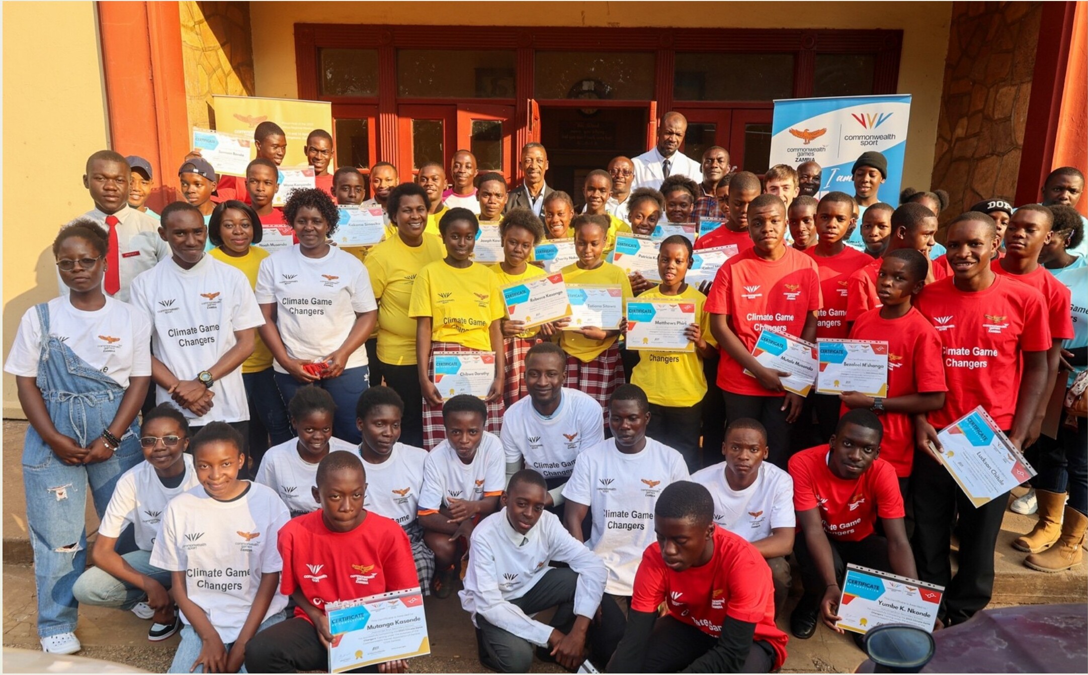 Climate Game Changers participants holding certificates at the Kabulonga Boys Secondary School certification ceremony in Lusaka, Zambia