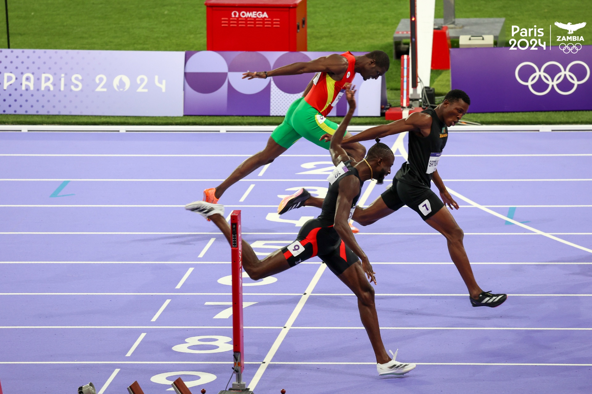 Track & Field Excellence - Athletes competing in hurdles at Paris 2024 Olympic Games, showcasing peak athletic performance