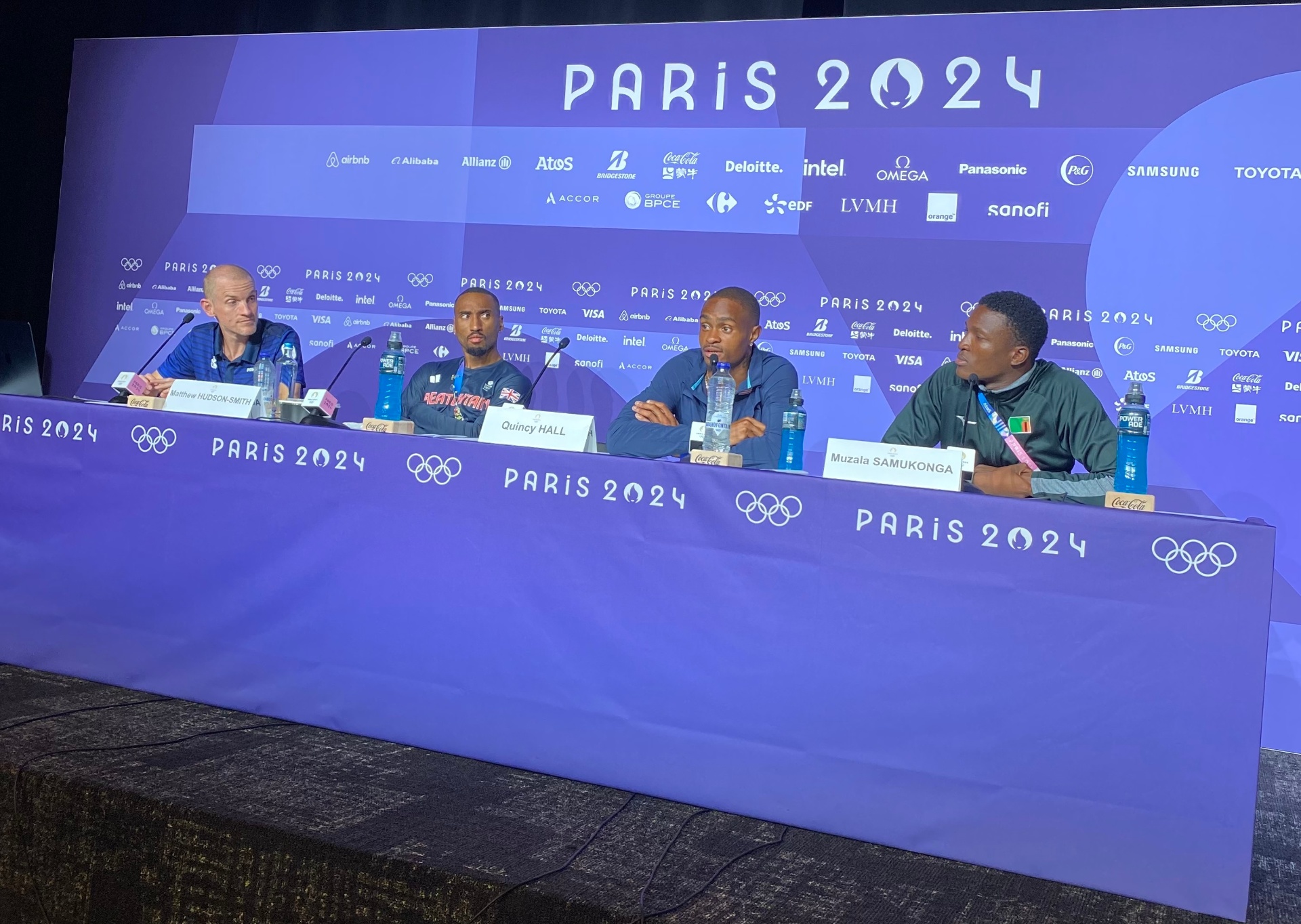 Muzala Samukonga at press conference with Men's 400m final medalists