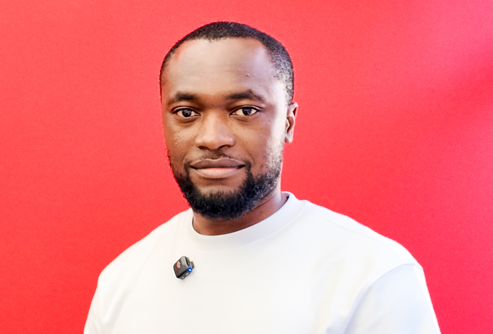 Portrait of Felix Munyika, communications and major events professional, wearing a dark suit